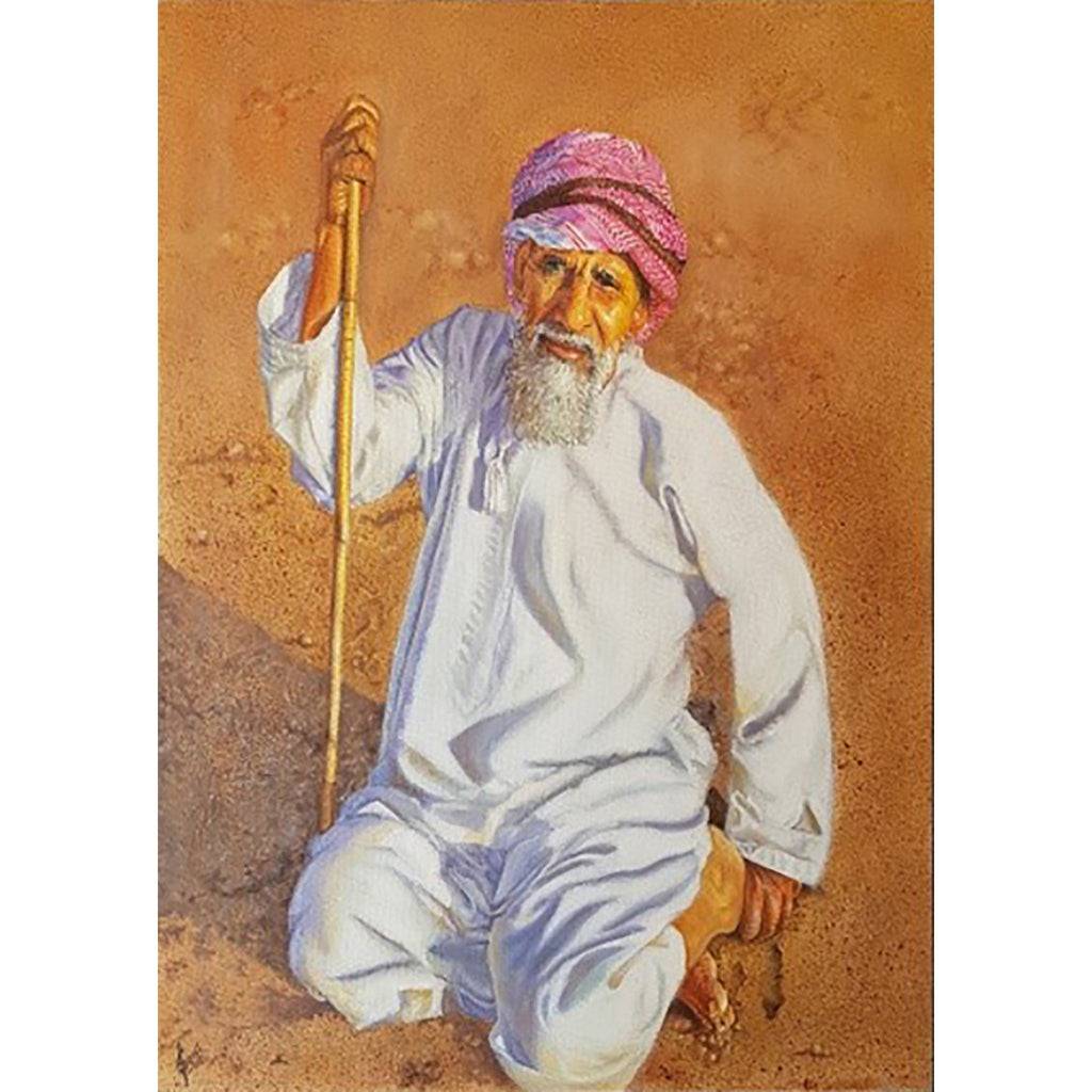 One old Arabian man holding wooden cane stick while kneeling on the sand